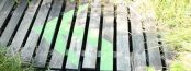 A picture of an arrow on a boardwalk
