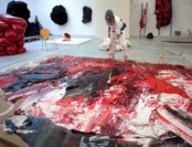 artist painting in the studio