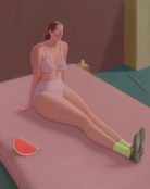 portrait of a woman sitting on bed
