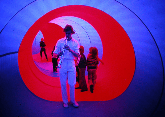 Image shows photograph of Music inside a structure — Action Space Archive